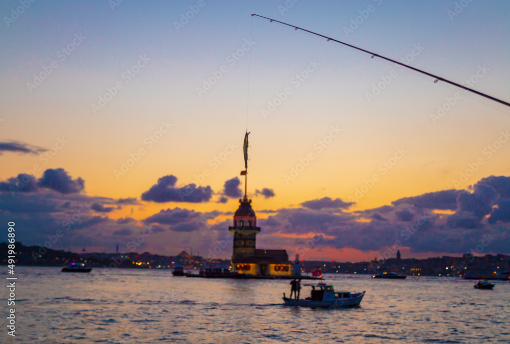 Maidens Tower at sunset, İstanbul. Beautiful clouds with blue sky. Historical light house of İstanbul