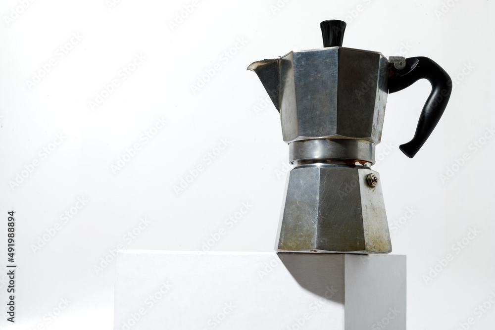 Classic Italian geyser coffee maker on the white background. Classic Italian geyser coffee maker on the white background.