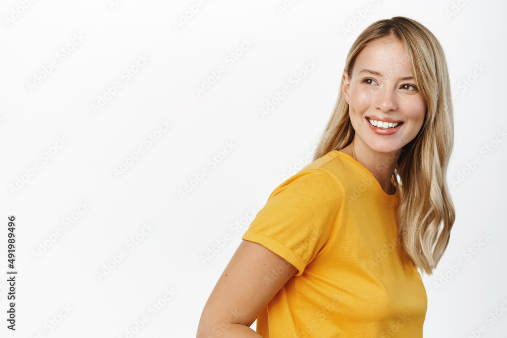 Portrait of happy modern woman, beautiful girl with white smile, bloind hair and clear natural skin without makeup, standing over white background Portrait of happy modern woman, beautiful girl with white smile, bloind hair and clear natural skin without makeup, standing over white background