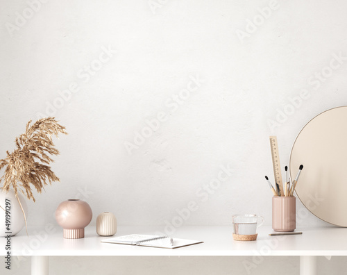 Home work place, table with decor and blank wall mockup close up, 3d render