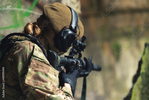 Konstfotografi Tender feminine touch to tough military army soldier aiming