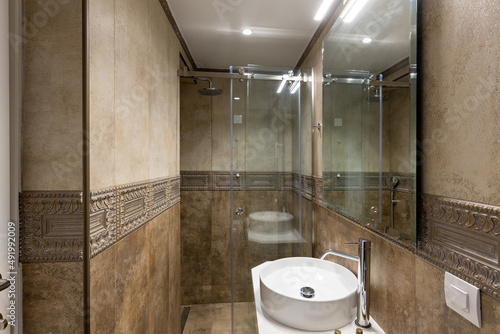 Luxury bathroom interior with glass shower wall