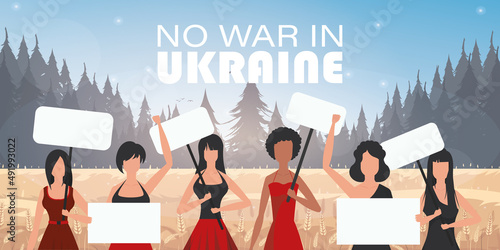 A group of women are holding banners. Pray for Ukraine. Stop war