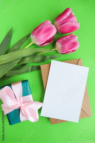Fototapeta Naklejka Na Ścianę i Meble -  beautiful bouquet of pink tulips and a gift box with a pink bow 
