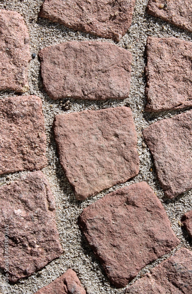 Close up of a red cobblestone walkway Close up of a red cobblestone walkway