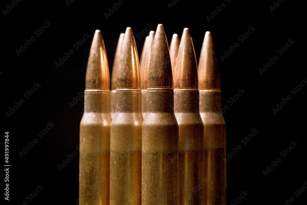 Cartridges for weapons close-up, black background, copy space Cartridges for weapons close-up, black background, copy space