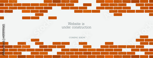 Website is under construction text and brick background.	