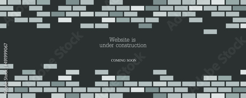 Website is under construction text and brick background.	