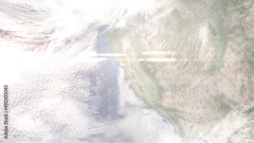Earth zoom in from outer space to city. Zooming on Hayward, California, USA. The animation continues by zoom out through clouds and atmosphere into space. Images from NASA photo