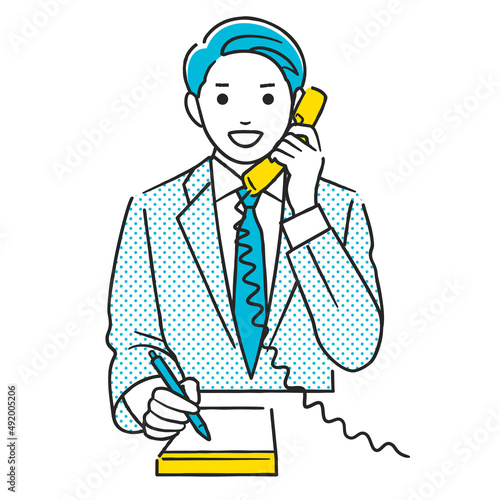 電話しながらメモをとる男性