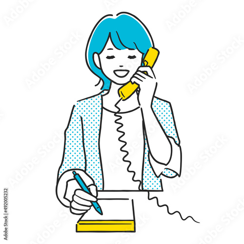 電話しながらメモをとる女性