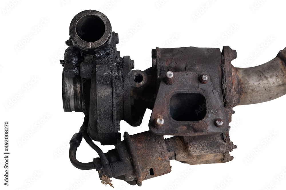 Old and worn car turbo charger. View of the flange on exhaust manifold, with broken nuts or screws. Turbo intake, oily and greasy on a white background. Old and worn car turbo charger. View of the flange on exhaust manifold, with broken nuts or screws. Turbo intake, oily and greasy on a white background.