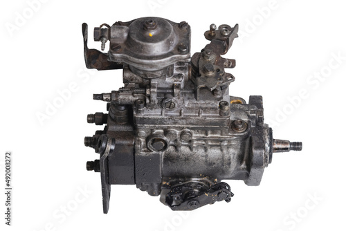 Old and worn diesel car high pressure pump on a white background. Automotive diesel pump  mechanical  from older type car. Side view.