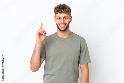 Young caucasian handsome man isolated on white background pointing up a great idea