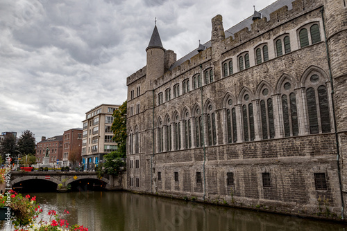 Moody daytime travel photograph from the historical center of Gent, Belgium. Cloudy sky.