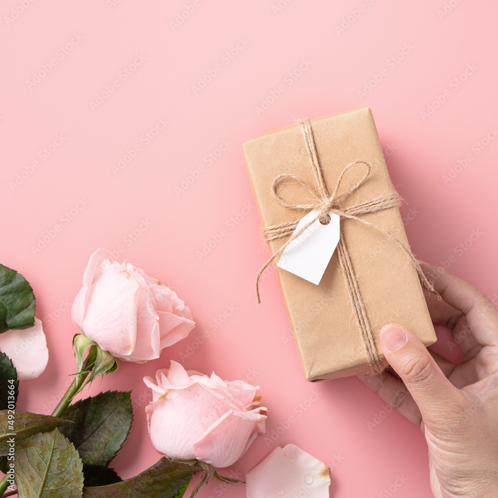 Mother's Day design concept background with pink rose flower and gift on pink background. Mother's Day design concept background with pink rose flower and gift on pink background.