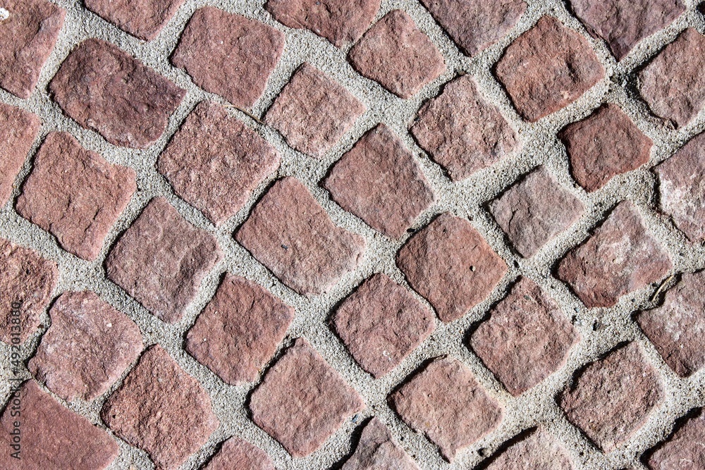 Close up of a red cobblestone walkway Close up of a red cobblestone walkway