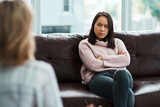 Therapy isnt for everyone. Shot of a young woman having a therapeutic session with a psychologist.