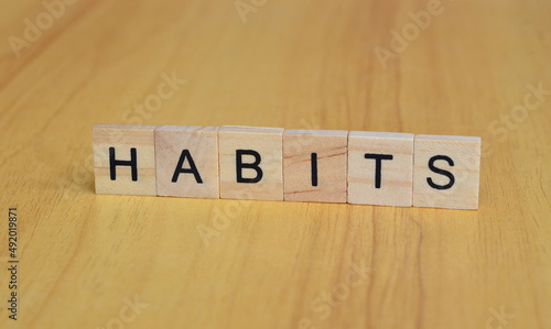 habits text on wooden square, business quotes