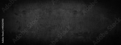 Black anthracite dark gray grey grunge old aged retro vintage stone concrete cement blackboard chalkboard wall floor texture, with cracks - Abstract background banner panorama pattern design template