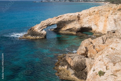 view of the bridge of lovers on the seashore with rocks in ayia napa