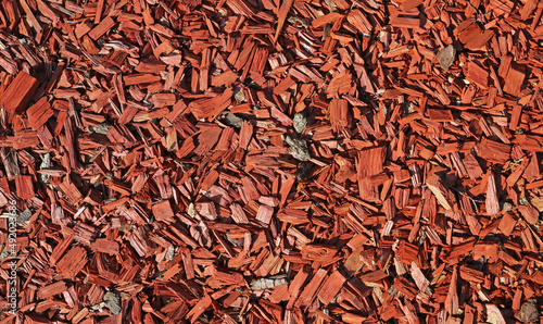 Full frame closeup of brown red bark mulch for cover of garden bed