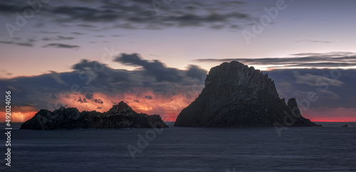 Es Vedra Island after sunset with lightnings , Ibiza 