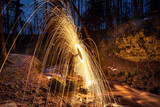 Burning steel wool spinned. Showers of glowing sparks from spinning steel wool