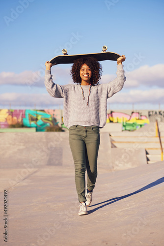 Why walk when you can skate. Shot of a young woman out skateboarding in the city.