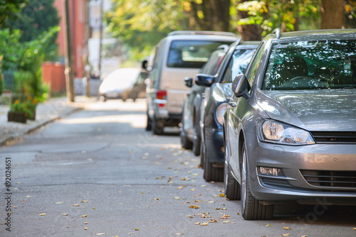 City traffic with cars parked in line on street side © bilanol