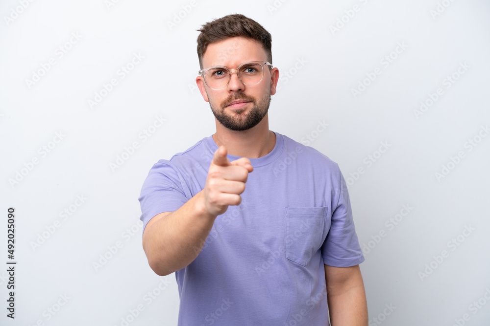 Young caucasian man isolated on white background frustrated and pointing to the front Young caucasian man isolated on white background frustrated and pointing to the front