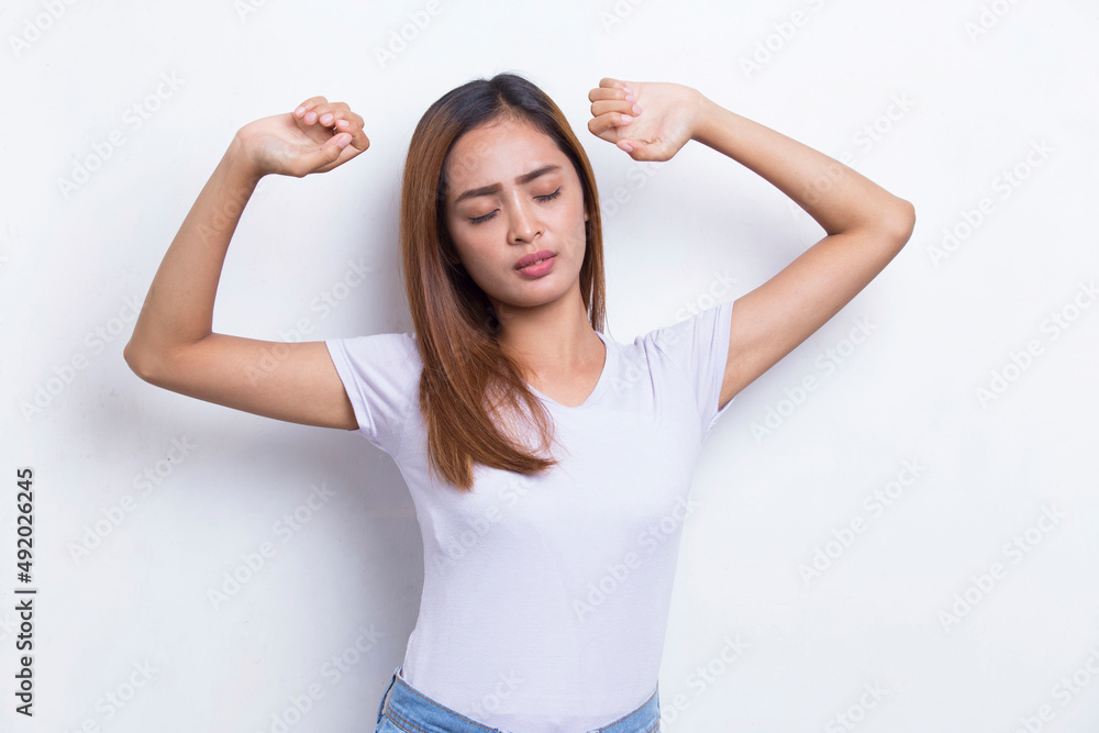 beautiful young asian girl waking up stretching isolated on white background
beautiful young asian girl waking up stretching isolated on white background