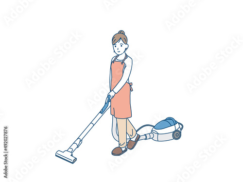 掃除機をかける主婦　エプロン姿の女性　掃除