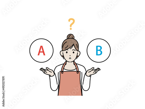 選択　どちらか選ぶ　考える　主婦　エプロン姿の女性　疑問　チョイス