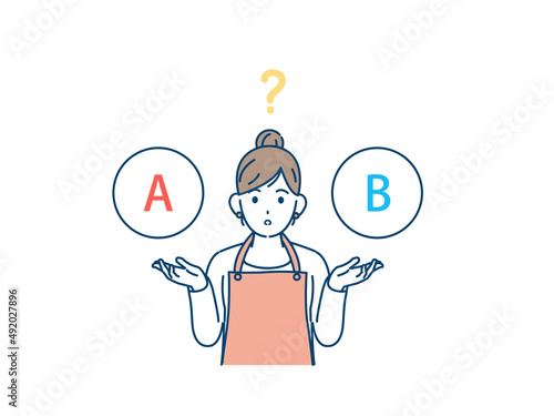 選択　どちらか選ぶ　考える　主婦　エプロン姿の女性　疑問　チョイス