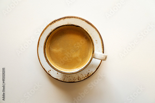 Black morning coffee on a table, top view. © Savvapanf Photo ©