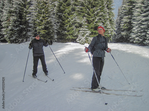 Man and woman cross-country skiing, winter sport