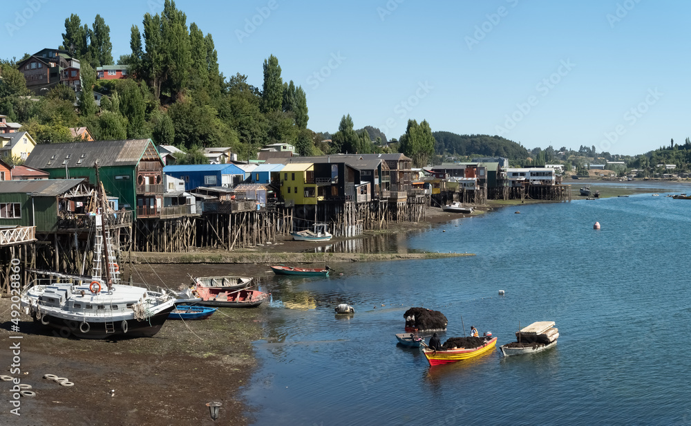 Fascinatinhg stilt houses (palafitos) on the fjord shores of the city of Castro, Chiloe Island, Chile