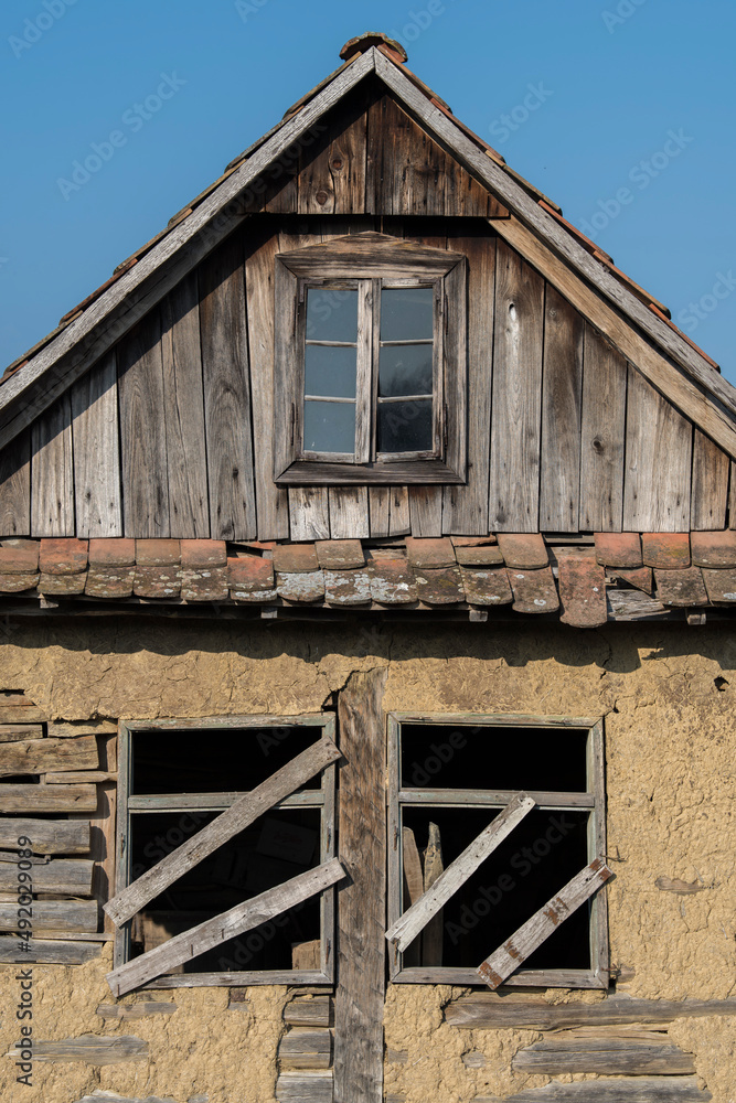 Sunja, Croatia, April 20,2021 :Abandoned traditional old wooden house. Sunja, Croatia, April 20,2021 :Abandoned traditional old wooden house.