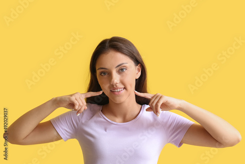 Pretty teenage girl pointin...