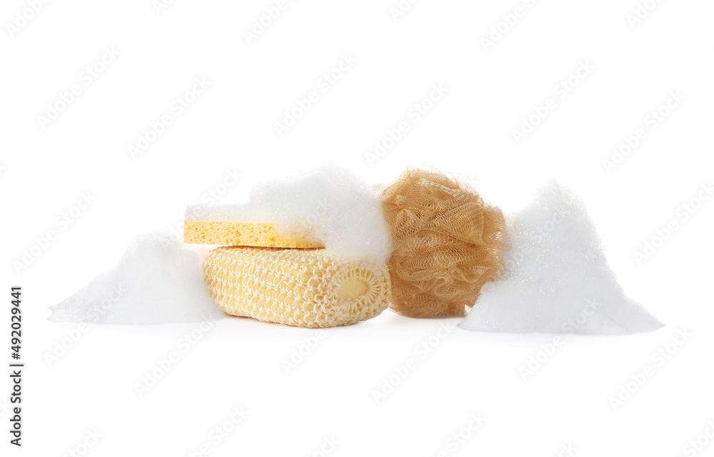 Different bath sponges and foam on white background Different bath sponges and foam on white background
