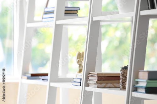White book shelves in modern room  closeup