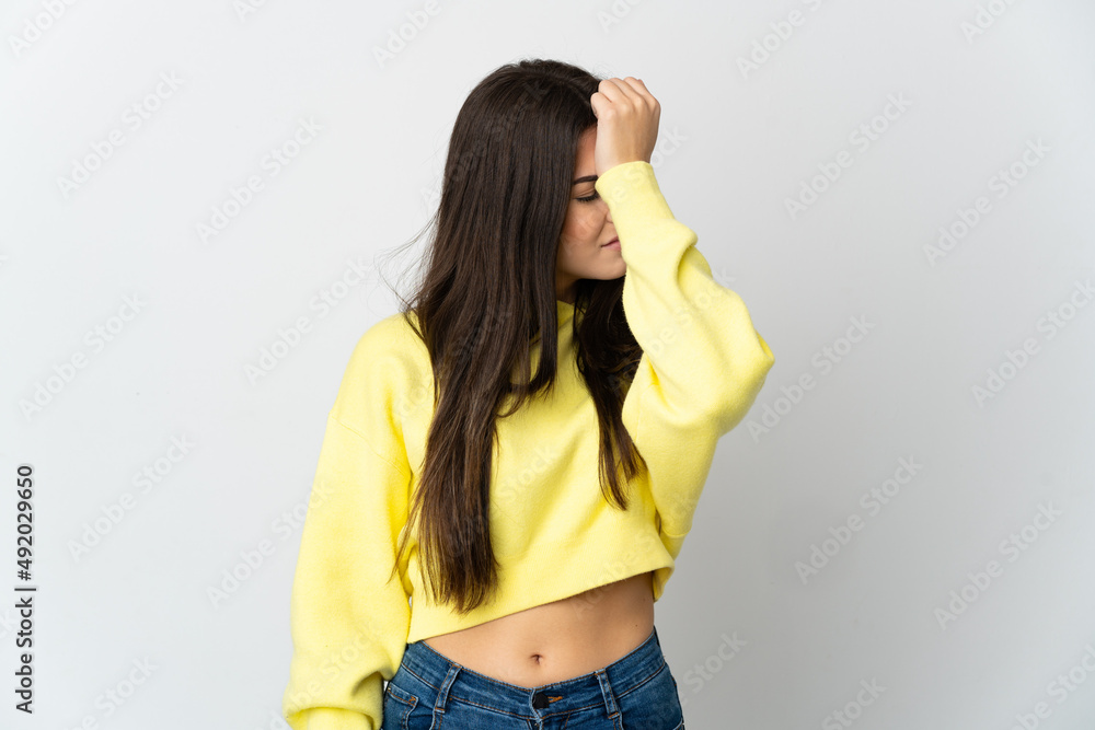 Teenager Brazilian girl isolated on white background with headache Teenager Brazilian girl isolated on white background with headache