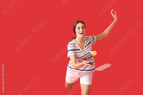 Sporty female badminton pla...