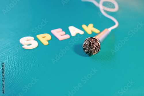 microphone on green background with word 