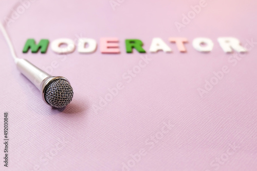 microphone on pink background with word 