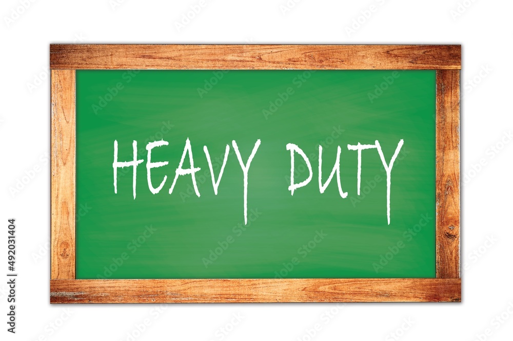 HEAVY DUTY text written on green school board. HEAVY DUTY text written on green school board.