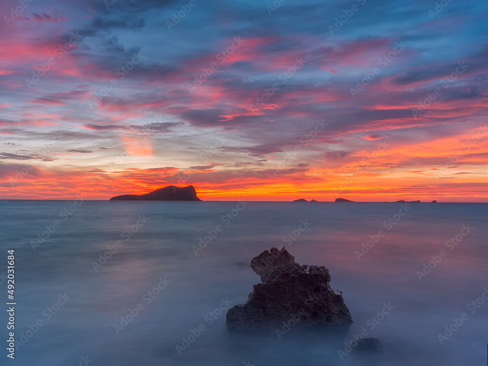 Ibiza red sunset by the sea , Cala Conta Ibiza red sunset by the sea , Cala Conta