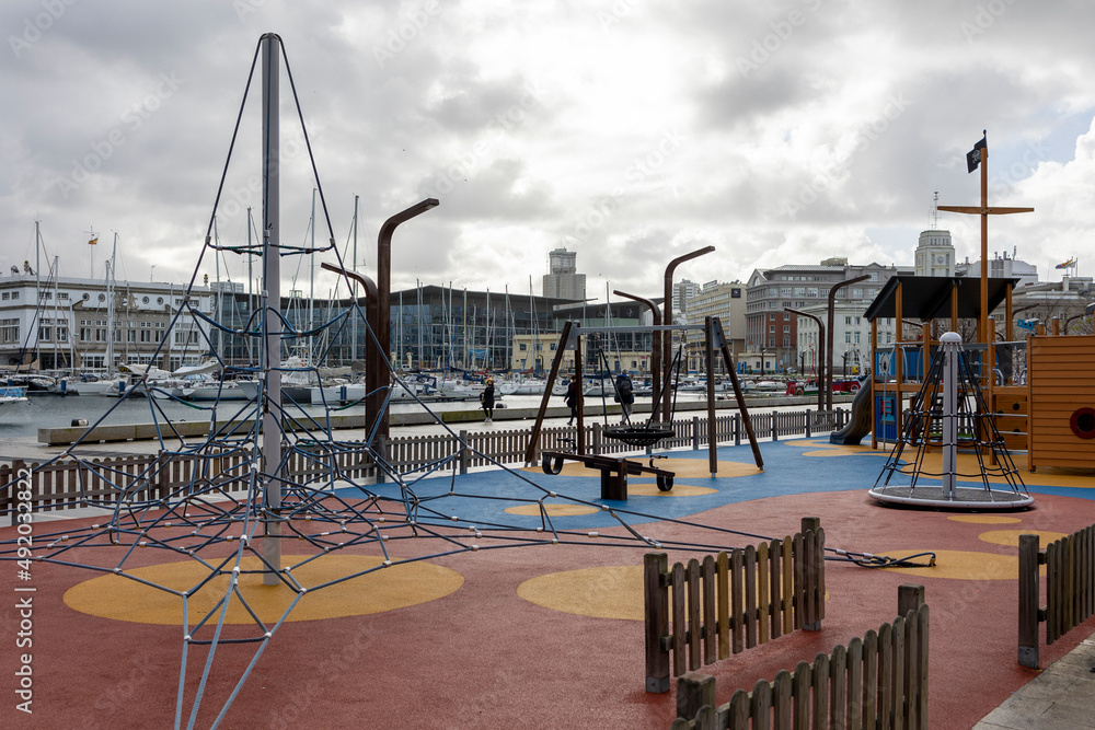 Empty playground for children in cloudy weather. Empty playground for children in cloudy weather.