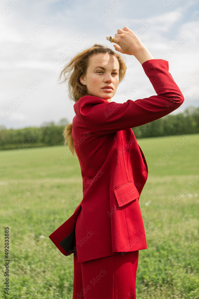 Obraz premium Fashion portrait of a beautiful and cute girl in nature in stylish clothes
